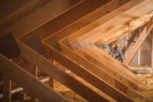 Insulation installer in attic